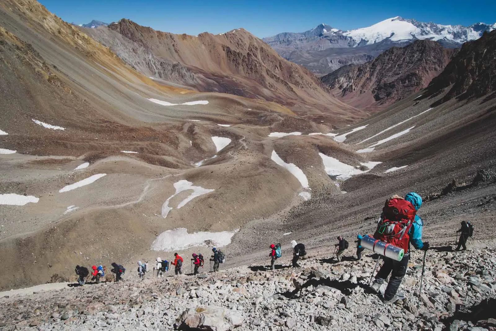 Hiker overlooking the peaks of the Andean Highlands